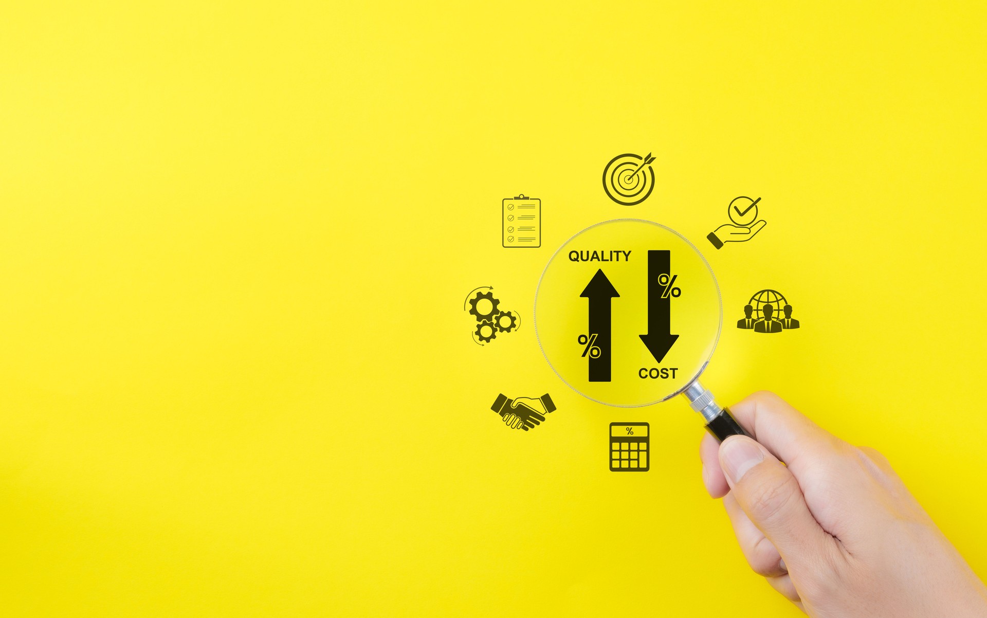 Effective business concept. Quality increase and cost reduction. Hand holds a magnifying glass over icons representing quality control increase, cost reduction, business efficiency, and optimization.